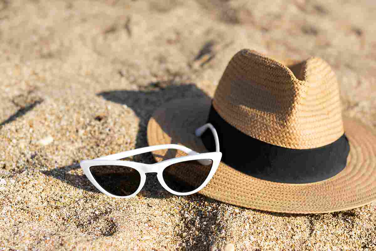 sun-glasses-and-flip-flops-on-a-tropical-beach